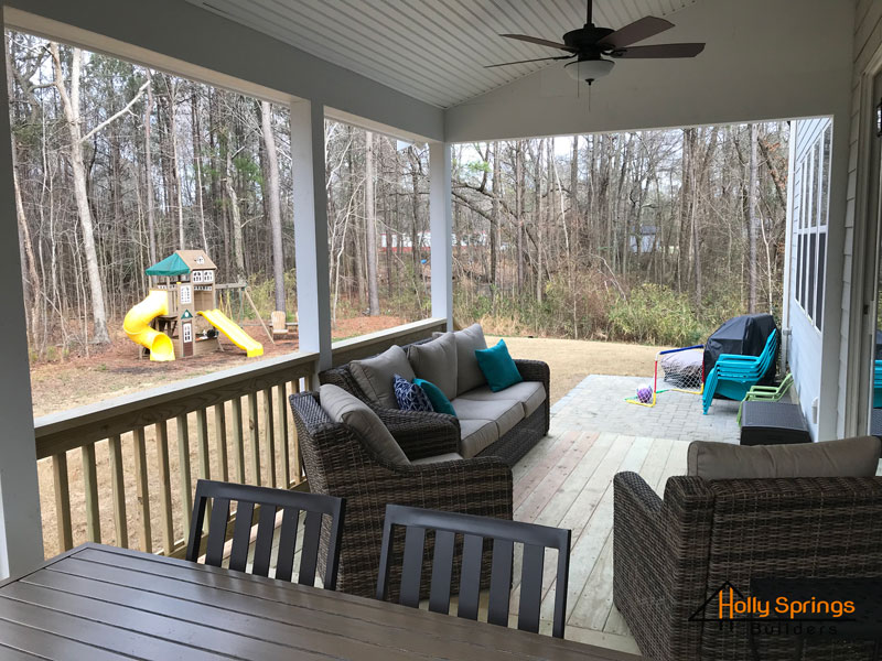 Covered Deck with Ceiling Fan & furnished - Holly Springs Builders