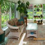 Sunroom with plants creating a sunroom retreat - Holly Springs Builders