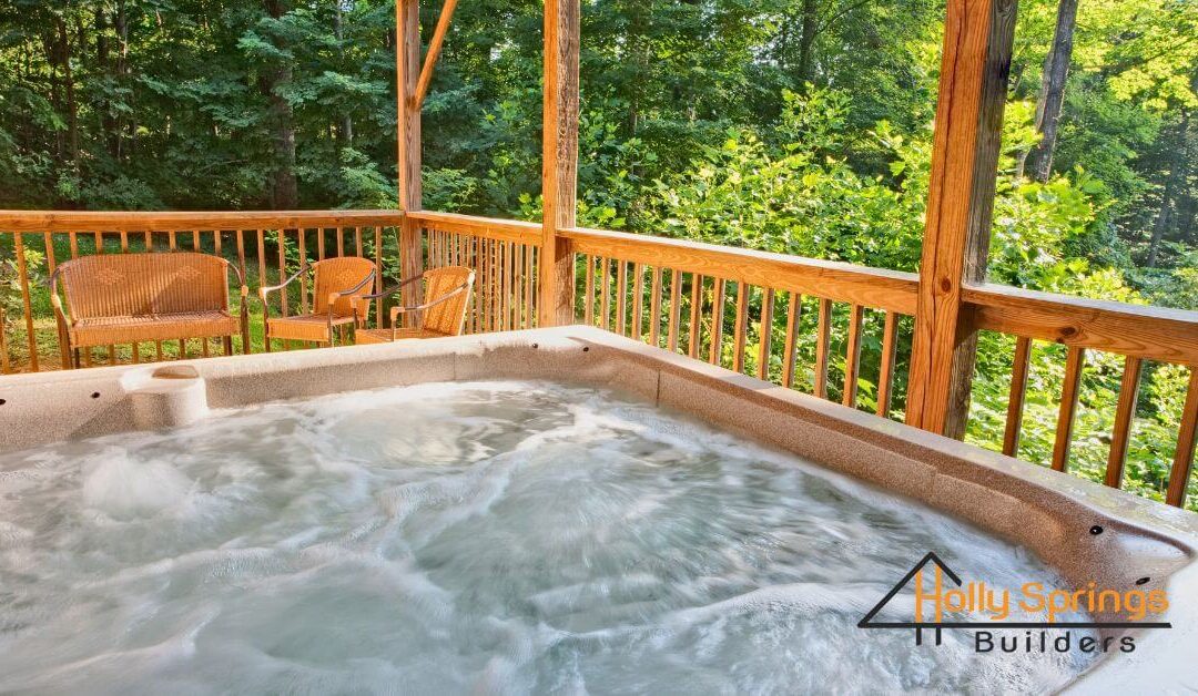 Deck hot tub with bubbling waters - Holly Springs Builders