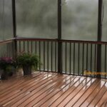 Stormy Days - soaked screened in deck with plants - Holly Springs Builders